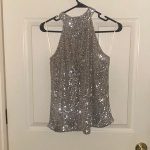 Beautiful top. Woman’s size medium silver sequin. New with tags, never worn.